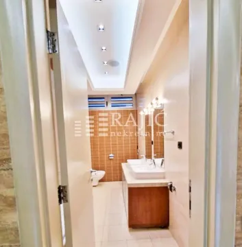 View of a modern bathroom with double sinks. - image 7