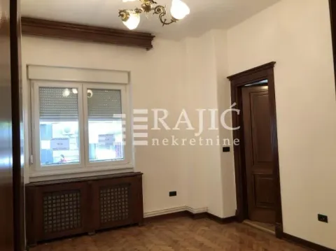 Empty room with parquet flooring, wooden trim, and a door. - image 8