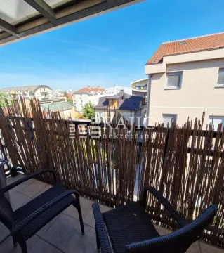 Furnished terrace with seating set and city view. - image 5