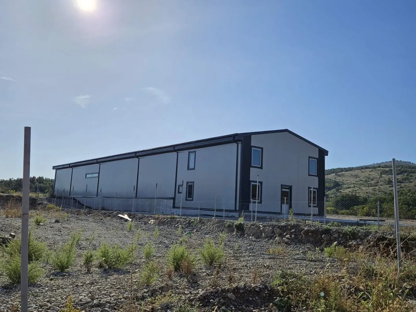 Exterior of a new industrial or warehouse building.
