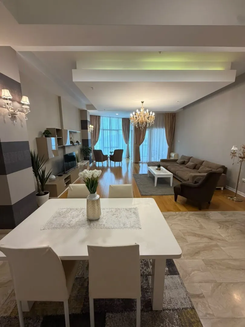 Spacious living room with a dining area and seating set.