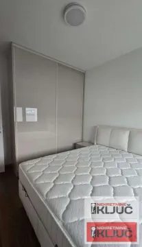 Bedroom with a double bed and a fitted wardrobe. - image 4