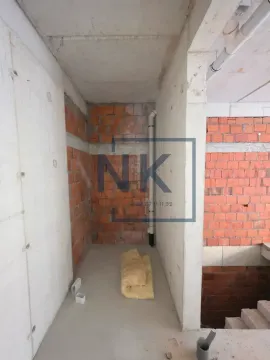 Unfurnished space in grey construction phase with installations. - image 3
