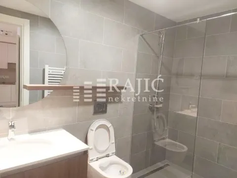 Modern bathroom with a walk-in shower and washbasin. - image 7