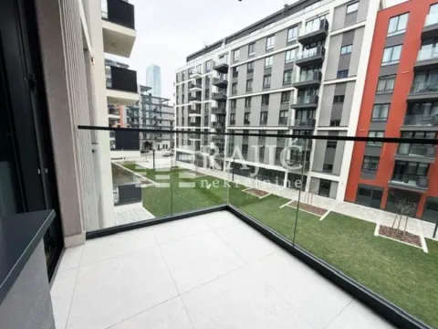 View from the tiled terrace overlooking the courtyard and surrounding buildings. - image 9