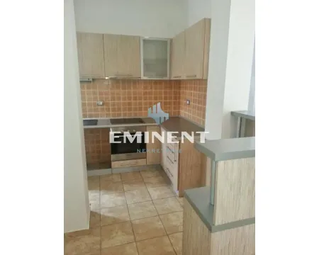 Small kitchen with wooden elements and ceramic tiles. - image 3