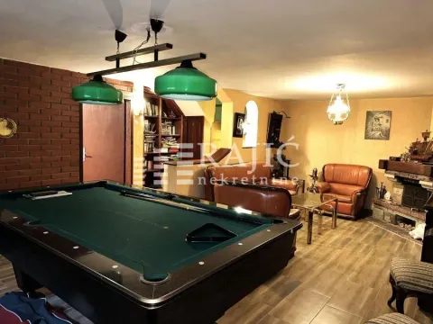 Living room with a billiard table and seating set. - image 11