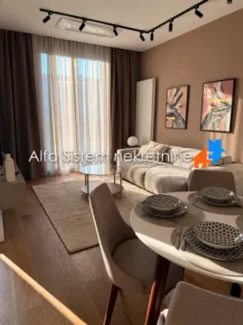 Living room with a dining area and seating set. - image 8