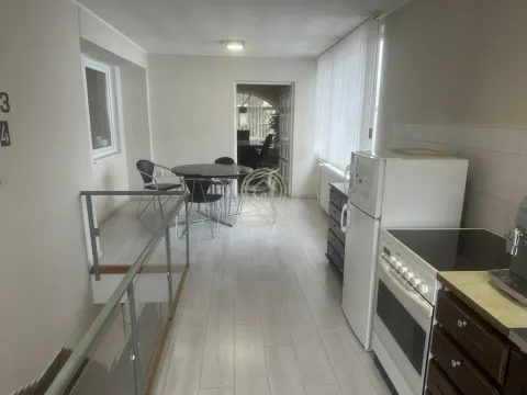 Kitchen with dining area and staircase inside the property. - image 7