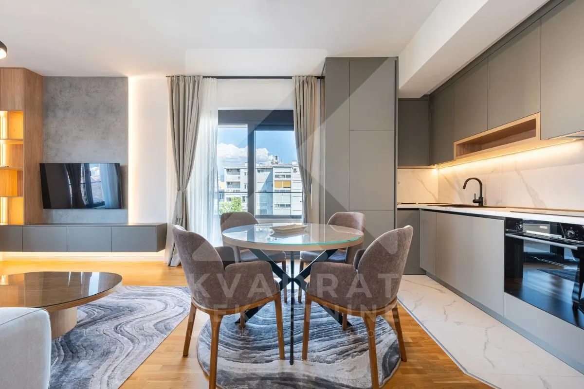 Modern kitchen with dining area and part of the living room.