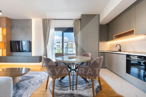 Modern kitchen with dining area and part of the living room. - image 7