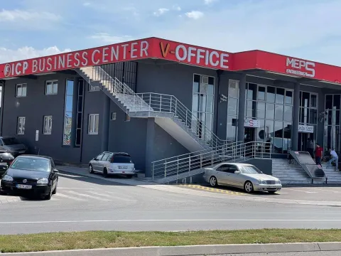 Exterior of a commercial building with parking in front. - image 6