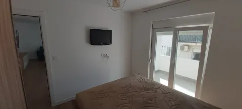 Bedroom with balcony access. - image 6