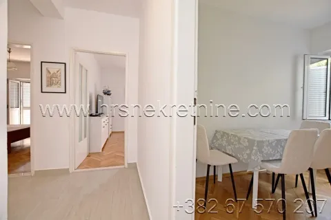 Interior of the apartment with a dining area and a view of the hallway. - image 8