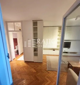 View of the living room and hallway with parquet flooring. - image 5
