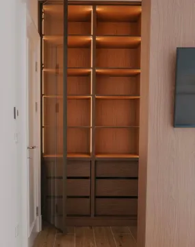 Built-in wooden wardrobe with interior lighting. - image 13