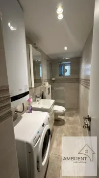 Kupatilo opremljeno sanitarijama, tuš kabinom i veš mašinom. - image 15
