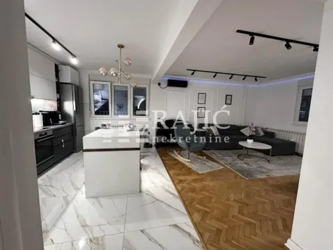 Modern living room connected to the kitchen and dining area. - image 2