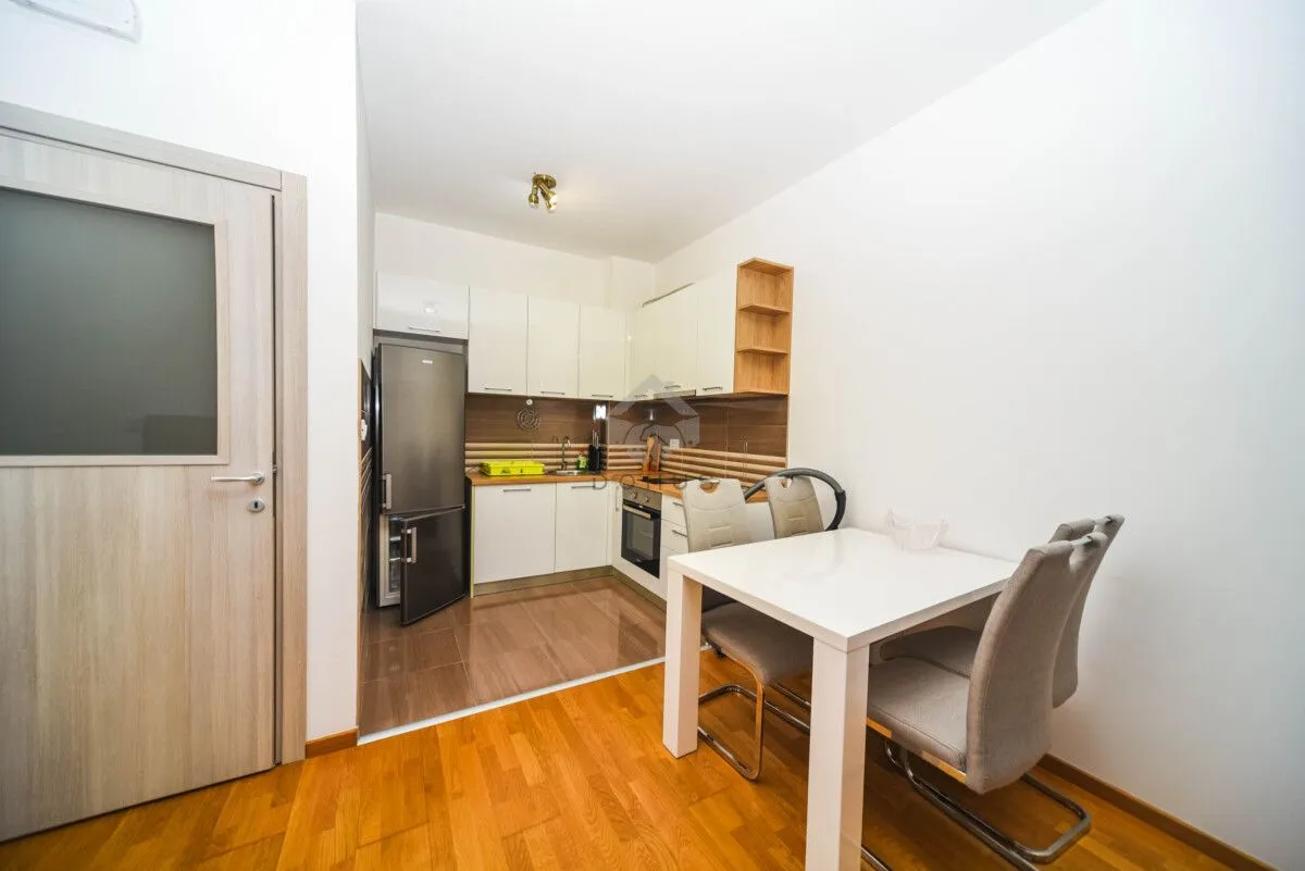 Kitchen with dining area and white cabinets.
