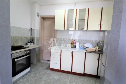 Small kitchen with cabinets and built-in appliances. - image 9