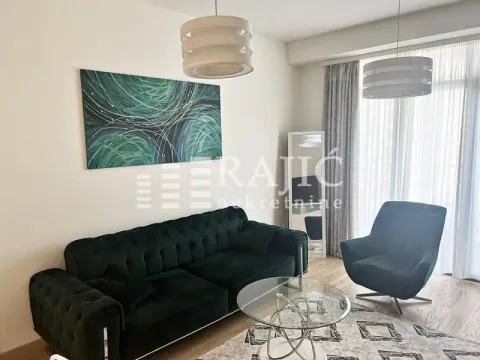 Modern and bright living room with a sofa and an art painting on the wall. - image 3