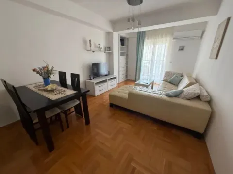 Living room with a sofa set and a dining table. - image 8