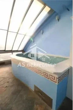 Bathroom with a large bathtub and skylights. - image 19