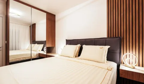Modern bedroom with a double bed, mirrored built-in wardrobe, and wooden wall panels. - image 8