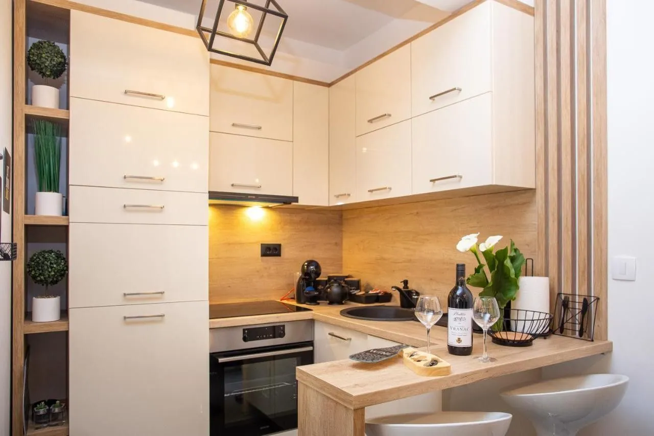 Modern kitchen with built-in appliances and a dining bar.