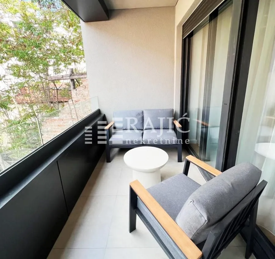Furnished terrace with seating furniture.