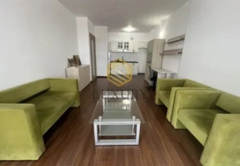 Living room with a sofa set and a view of the kitchen in the background. - image 5