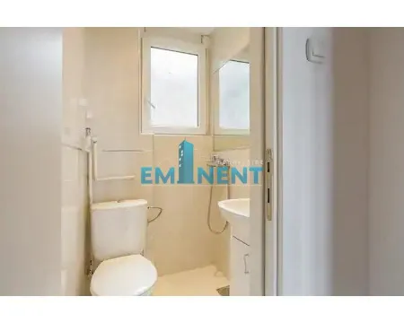 View of a smaller bathroom with sanitary ware and a window. - image 16