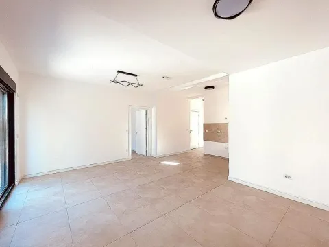 Empty bright room with ceramic floor tiles and white walls. - image 5