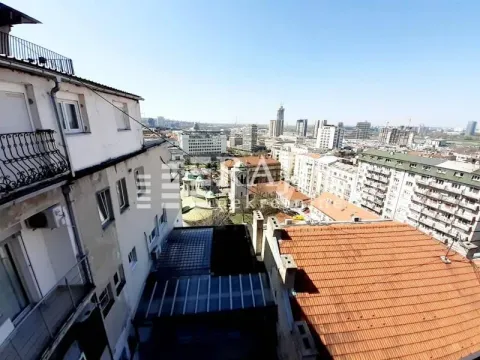 View from the terrace overlooking the city neighborhood and rooftops. - image 13