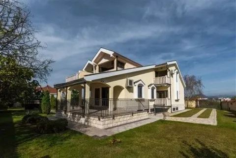 Modern two-story house with a landscaped yard and a terrace. - image 32