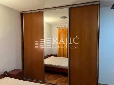 Bedroom with a large mirrored wardrobe and a double bed. - image 12