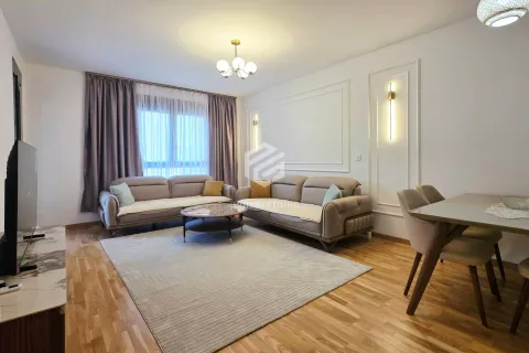 Spacious living room with sofa set, coffee table, and dining table. - image 19