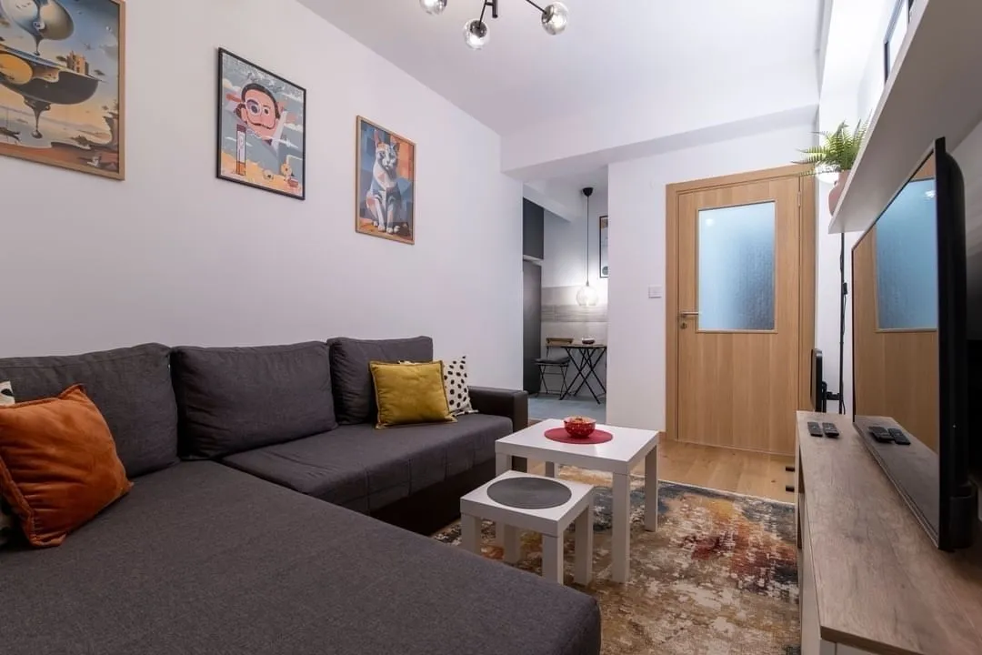 Bright living room with a corner sofa.