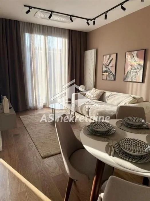 Living room with dining area and seating furniture.