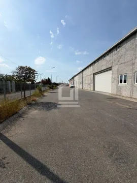View of the exterior part of the building and access road with yard. - image 11