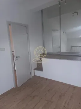 Small room with white door and built-in mirrored wardrobe. - image 8