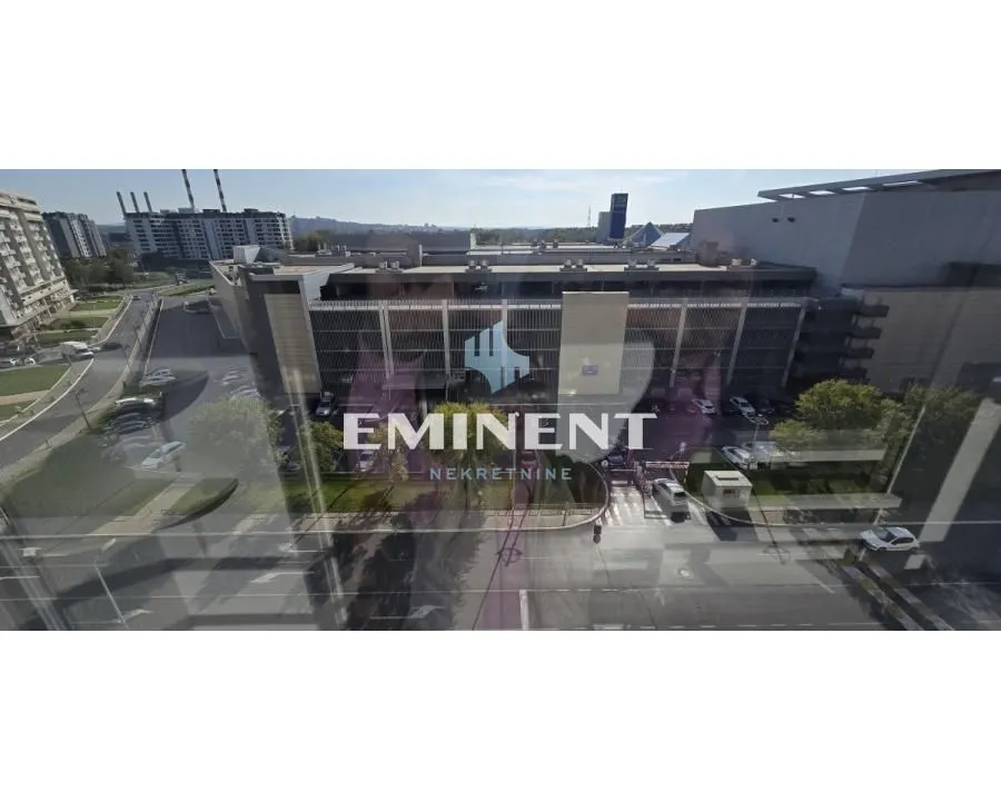 View through the window of surrounding buildings and the street.