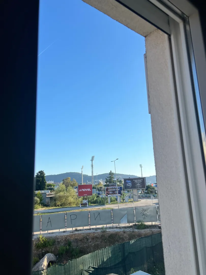 View through the window of the surrounding landscape and city.