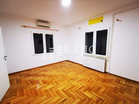 Empty room with parquet flooring and white walls. - image 4