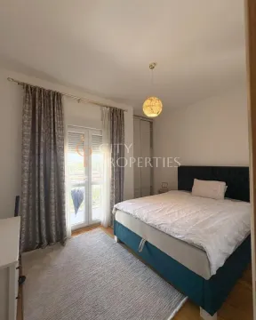 Furnished bedroom with a double bed, wardrobe, and access to the terrace. - image 13