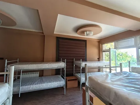 Bedroom with several bunk beds and access to the terrace. - image 3