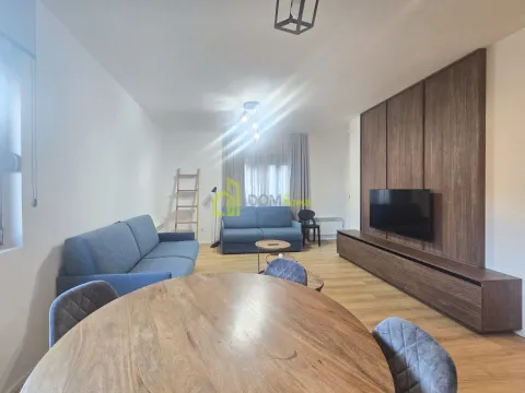 Spacious living room with a sofa set, dining table and TV unit. - image 5