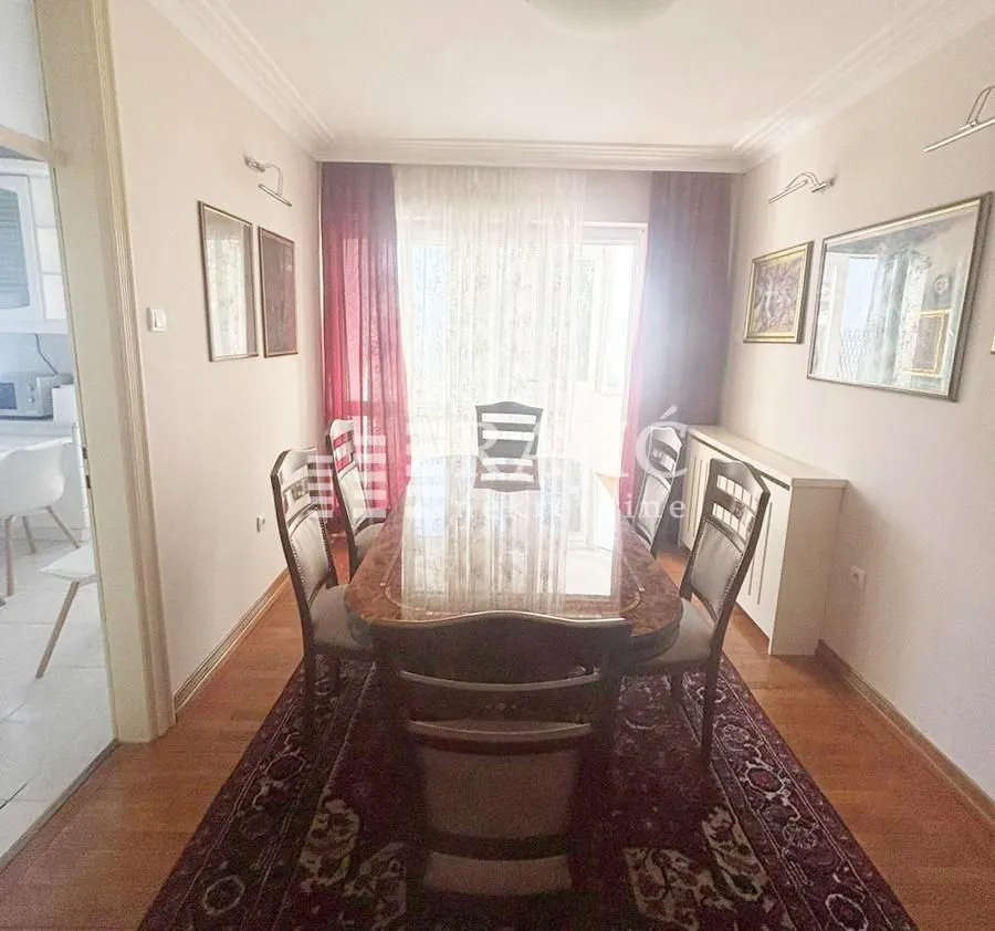 Dining room with a large table and chairs in the apartment.