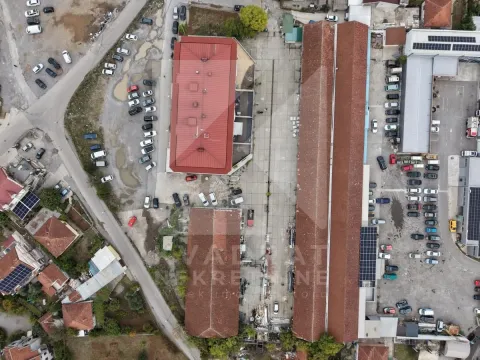 Aerial view of an industrial complex with warehouses and parking area. - image 5