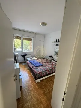 View of the bedroom with a bed, wardrobe, and window. - image 8